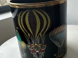 a black trash can with a picture of hot air balloons on it
