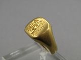 an image of a gold signet ring with an eagle on it