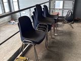 many chairs that are lined up in a room