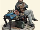 une figurine représentant un homme assis à une table avec une valise