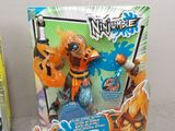 two action figures that are on display in front of a box