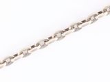 a close up of a silver chain on a white background