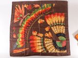 an image of a brown scarf with orange and yellow flowers