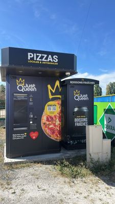 a vending machine that has a pizza on the front of it