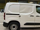a white van that is parked in a garage