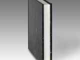 an image of a black book with white pages on a gray background