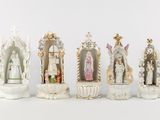 seven figurines of different sizes and shapes