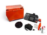 a box with a camera and other items in it