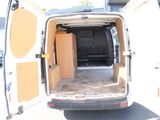 a white van with its doors open in a parking lot