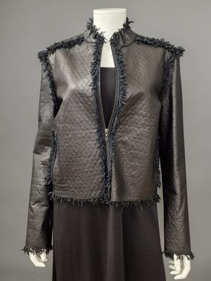 a black leather jacket with fringes on a mannequin mannequin mannequin mannequin mannequin mannequin mannequin manne