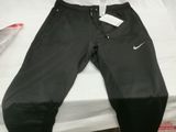 the pants are black and have a white nike logo on them
