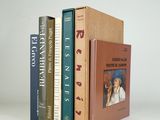 three books that are stacked on top of each other