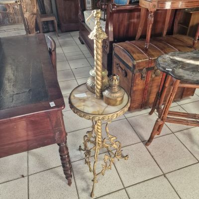 a table with a lamp on top of it in a room