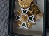 a box with a medal and a ribbon in it