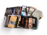 a lot of books that are sitting on a table