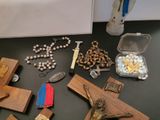 a table with a bunch of religious items on it
