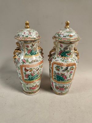 pair of chinese vases with birds and flowers painted on them