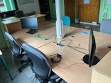 a desk with a computer and a monitor on it