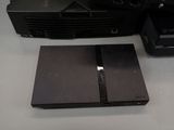 a video game system sitting on a table next to a tv