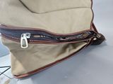a bag with a zipper on it sitting on a table