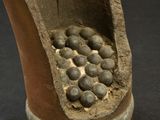 a clay sculpture of a foot with a hole in it