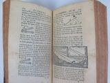 an open book with a drawing of a plane on it