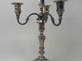 silver plated candelabra with three candles on a stand