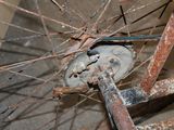 a close up of a bicycle wheel that is rusted