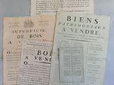 three old newspapers sitting on top of a table next to a cup of coffee