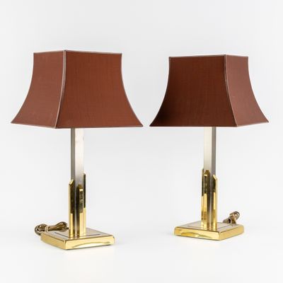a pair of brass table lamps with brown shades