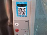a close up of a machine with a qr code on it
