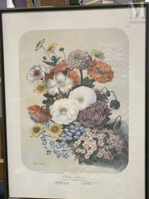 a framed picture of a bouquet of flowers on a table