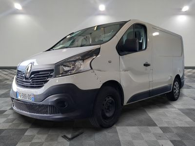 the white van is parked on a checkered floor in a room