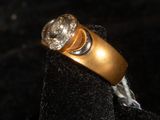an image of a gold ring with diamonds on it