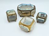 several pieces of jewelry sitting on top of a table next to each other
