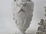 two statues that are sitting next to each other on a table