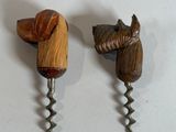 two wine openers with a horse head on them