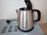 a coffee pot that is sitting on top of a table