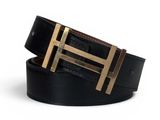 a close up of a black belt with a gold buckle
