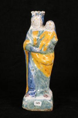 an image of a ceramic figurine of a woman holding a child