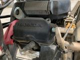 a close up of a motorcycle engine on a street
