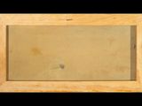 an old picture of a wooden frame with a small hole in it