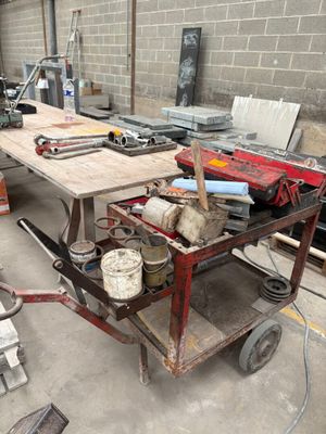 a workbench with tools on it in a building