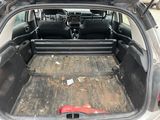 a trunk of a car with the back seats folded down