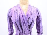 an image of a woman ' s purple dress on a mannequin