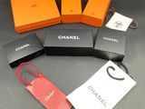 four boxes of different colors and sizes of chanel purses