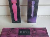 purple and black box with a pink handle and a black and white box with a pink handle and a purple and black box with a pink handle and black and white