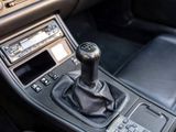 a close up of a car dashboard with a gear stick