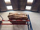 boxes are stacked on a rack in the middle of a warehouse