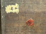 a piece of wood that has some paint on it